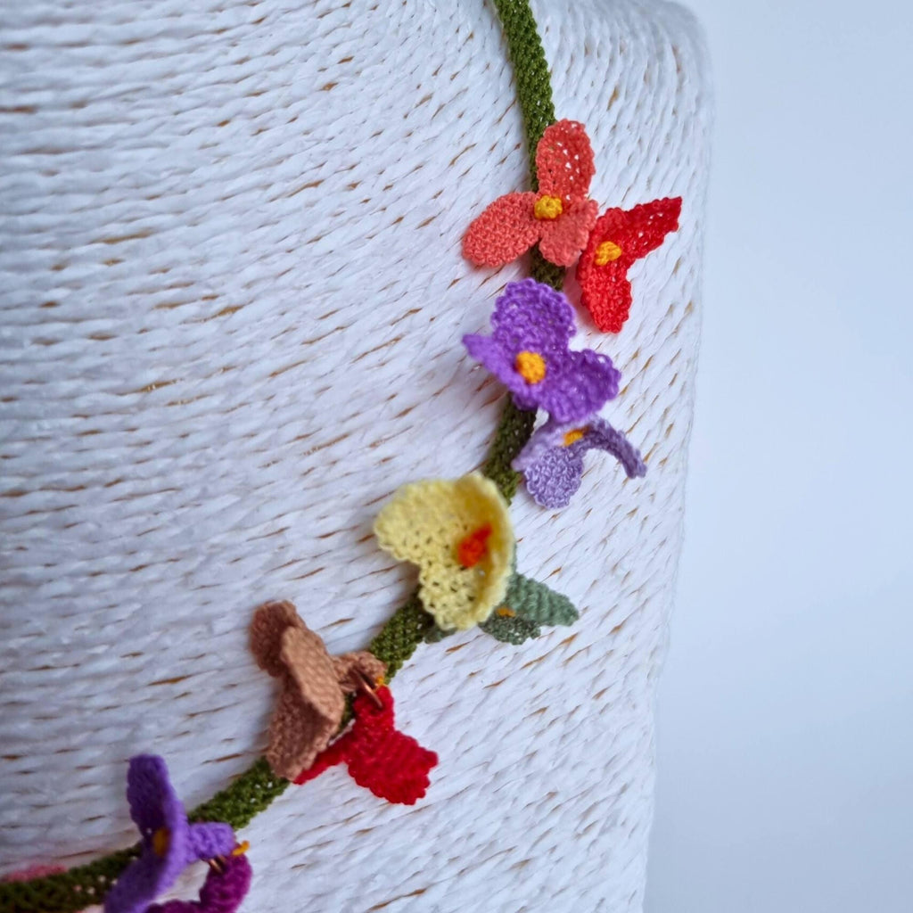 Handmade colorful floral necklace with beaded flower details in boho style