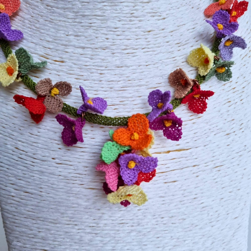 Handmade colorful floral necklace with beaded flower details in boho style
